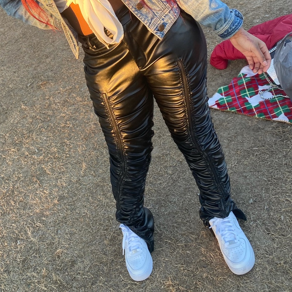 Black leather stacked pants